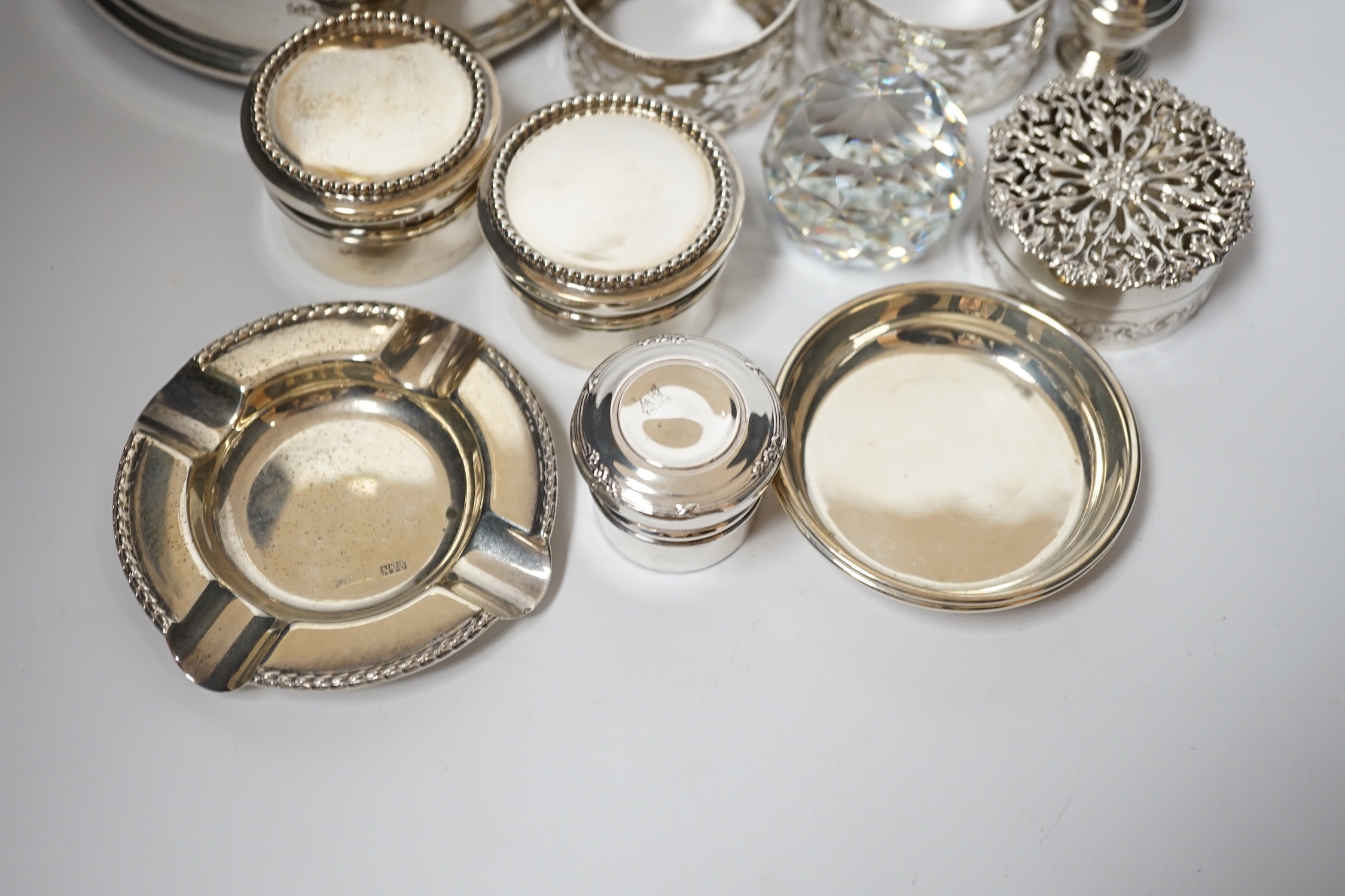 A small collection of sundry small silver including modern silver mounted wine coaster, coffee can holders, salt, taste vin, pot pourri box, pill boxes, Georgian pepperette, small dishes etc.
